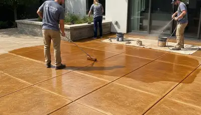 Professional concrete staining on residential driveway in Atlanta, GA for durable exterior finish